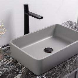 Rectangular grey color concrete above countertop sink 